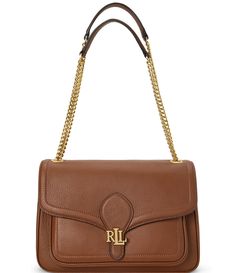 From Lauren Ralph Lauren&#x2C; the Pebbled Medium Bradley Convertible Shoulder Bag features:Polished “LRL” metal hardwareShell: leatherLining: cottonMagnetic snapped closureExterior: slip pocketInterior: zip pocket and a cargo pocketApprox. 11" H x 7.5" L x 3" DWeighs approx. 1 lb.&#x2C; 11.5 oz.Convertible chain strap with an approx. 21.5"LClean by a leather specialistIncludes a dust bagIm Frock And Frill, Tan Handbags, Lauren Brown, Convertible Bags, Brown Bags, Hand Bags, Lauren Ralph Lauren, Chain Strap, Pebbled Leather