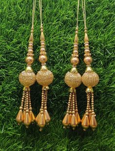 Indian Handmade Gold Latkan for Saree Blouse Lehenga HandBags Dupatta Decoration Bridal Wedding dress for Women pair of 2 pcs Size - 15.0 cm Length  Item Description You can use this Beautiful pair of tassle for several DIY projects.  *These beautiful Tassel Latkans are used as the accessory for saree blouse on the back, but u can use according to your need and your innovative ideas. * Package contains 2 Latkan / 1 Pair Other Than Saree Blouse, you can use these latkans in various ways Craft Projects Designing Home Decoration Festive celebrations. Evening and party Apparels. Home décor items Apparel & Fashion Scarves n Stoles Headband, hats Table cover, curtains, Pillow covers, Cushion cover Shoe designing Headband, hats Table cover, curtains Designing stylish blouses Ship From New Delhi, Bollywood Style Lehenga For Puja With Latkans, Bollywood Style Lehenga With Latkans For Puja, Traditional Wedding Sets With Latkans, Navratri Puja Lehenga With Latkans, Gold Dupatta With Latkans For Celebration, Celebration Gold Dupatta With Latkans, Festive Gold Sets With Latkans, Gold Traditional Drape Sets For Puja, Traditional Sets With Latkans For Eid