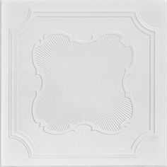 a white ceiling tile with an intricate design on the top and bottom half of it