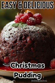 a christmas pudding with raspberries on top and the words, easy & delicious christmas pudding