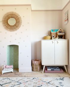 a room with a rug, cabinet and mirror on the wall in front of it