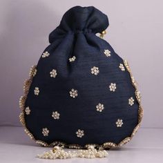 Material:Golden Lace Ribbon, Golden Metallic Wire, Motifs, ThreadColor: Navy Blue, Pink, Pistachio Green, Golden, Bronze, RedSize: 10" x 8"Designed with the heart, this beautiful Potli or batawa bag are eye catchy and made of premium material.Key Features:Embroidery art work. (gotta pati work).This potli is good match with both Indian and western outfits and are superb for wedding and festive parties.This would be best complement to your designer saree, lenhga or any other kind of dress.This is Wedding Party Bags, Golden Ribbon, Golden Lace, Potli Bag, Wedding Mehndi Designs, Wedding Bags, Potli Bags, Embroidery Designs Fashion, Pistachio Green