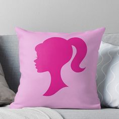 a pink silhouette of a woman's head on a pillow