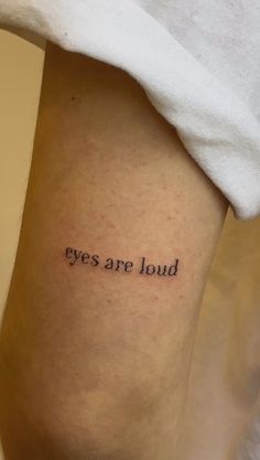 a person with a tattoo on their leg that says, but you are eyeballs