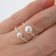 "SET OF 2 STERLING SILVER RINGS A beautiful twist on a standard pearl ring, these are made with chain for a unique look. This set of 2 rings is perfect for stacking up or worn alone for a minimalist look. Made out of sterling silver chain (which makes the rings \"flexible\") and Swarovski pearls. Comes packaged in a small gift box. SWAROVSKI PEARL: These are made with white Swarovski pearls in a 6mm size and a 4mm size. Pearl is also available in 5 colors: white, ivory, light pink, light grey, d Elegant Sterling Silver Chain Ring For Wedding, Elegant Sterling Silver Wedding Chain Ring, Pearl Chain Ring Jewelry, Elegant Sterling Silver Chain Ring Gift, Silver Minimalist Chain Ring For Wedding, Minimalist Silver Chain Ring For Wedding, Gift Pearl Ring With Pearl Chain Detail, Pearl Chain Ring Perfect As A Gift, Pearl Rings With Pearl Chain For Gift