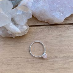 💓Wire Wrapped Rose Quartz Crystal Ring - 1 Ring💓 *these beads are a little more pink than the photo captures, it was hard to capture in this lighting This ring features a natural (not dyed) tiny 4mm rose quartz crystal bead, wrapped in your choice of wire. The options are silver plated, copper, bronze, black, or gold colored wire. All except the silver plated have a non tarnish coating so they will never oxidize or change color. Being careful to not wear your rings while showering or washing y Pink Rose Quartz Hand Wrapped Jewelry, Stackable Rose Quartz Jewelry For Gifts, Hand Wrapped Rose Quartz Pink Jewelry, Pink Sterling Silver Moonstone Promise Ring, Hand Wrapped Pink Rose Quartz Jewelry, Rose Quartz Crystal Ring For Promise, Silver Rose Quartz Crystal Ring, Dainty Pink Crystal Ring, Delicate Pink Stackable Rings For Gifts