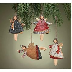 three christmas ornaments hanging from a pine tree