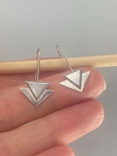 These geometric art deco inspired threader earrings have been handmade from recycled sterling silver and are really easy to wear - simply pull through and you're done! Measuring approximately 30mm full drop length by 15mm across, they are very lighweight and make a fabulous and unique gift. Modern Sterling Silver Threader Earrings, Modern Adjustable Sterling Silver Threader Earrings, Modern Silver Threader Earrings, Modern Silver Drop Threader Earrings, Modern Sterling Silver Nickel-free Threader Earrings, Modern Nickel-free Sterling Silver Threader Earrings, Adjustable Geometric Minimalist Earrings, Adjustable Minimalist Geometric Earrings, Modern Sterling Silver Threader Earrings As Gift