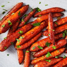 carrots on a plate with parsley sprigs