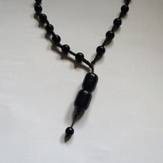 Black ball necklace attracts women for attractive rasta look Long Adjustable Necklace For Festival, Adjustable Long Festival Necklace, Casual Black Bead Jewelry For Festivals, Casual Festival Necklace With Adjustable Length, Adjustable Long Traditional Necklace, Casual Black Beaded Choker Necklace, Adjustable Traditional Long Necklace, Handmade Adjustable Necklaces For Meditation, Black Long Necklace With Adjustable Length