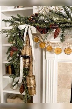 Fireplace Garland And Bells, Christmas Gold Bells, Scandi Christmas Garland, Gold Bells On Mantle, Christmas Decor Ideas For Window Display, Christmas Fireplace Garland Farmhouse, Gold Christmas Bells Decorations, Bells In Christmas Tree, Garland With Gold Bells