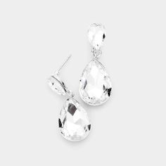 Clear Crystal Teardrop Silver Dangle EarringsItem: EarringsVendor: Sparkle ArmandColor : Clear, Silver Size : 0.5" W, 1.25" L Fastening: Post BackMetal: Alloy, Lead & Nickle FreeMaterial: Crystal teardrop Theme: Evening, Prom, Pageant, Bridal Teardrop Silver Earrings, Silver Bridal Earrings, Starburst Earrings, Clear Earrings, Statement Hoop Earrings, Prom Earrings, Stone Dangle Earrings, Teardrop Dangle Earrings, Heart Drop Earrings