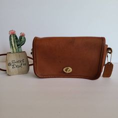 Vtg Classic Original Coach Kisslock DinkyLeather with brass hardwareRoomy interior with 1 slip pocket, attached kisslock coin pouch, outer slip pocket divided in two covered by a flap and secured with a turnlockDetachable 39" strapMeasures: 8"L, 5"H, 2"WMade in New York, USA#348-4644Flaws: 2 slots of leather in front, stains on front and stains on top and backCleaned, conditioned and ready to wear!Questions? Just askMore vtg coach colors/styles also availableRc029 Vintage Formal Bags With Turn-lock Closure, Vintage Rectangular Flap Bag With Gold-tone Hardware, Vintage Satchel Shoulder Bag With Turn-lock Closure, Vintage Rectangular Shoulder Bag With Turn-lock Closure, Vintage Crossbody Flap Bag With Detachable Strap, Vintage Leather Flap Bag With Gold-tone Hardware, Vintage Flap Bag With Detachable Strap For Formal Occasions, Vintage Flap Bag With Gold-tone Hardware For Everyday Use, Vintage Shoulder Bag With Turn-lock For Travel