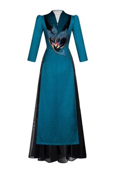 Indulge in the luxury of our ao dai. This stunning garment features a sleek panther print on soft zibeline fabric, while the A-line cut and v-neckline elongate and flatter. Elevate your wardrobe with this exclusive piece, perfect for any occasion. Elegant Fitted Silk Ao Dai, Elegant Blue Fitted Ao Dai, Elegant Blue Ao Dai For Formal Occasions, Elegant Silk Long Sleeve Ao Dai, Elegant Silk Ao Dai With Long Sleeves, Silk Ao Dai For Party, Traditional Fitted Silk Ao Dai, Elegant Evening Blue Ao Dai, Festive Fitted Blue Ao Dai