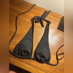 Brand New. Never Worn Bikini Top. Black. Size Small. Beachwear Triangle Halter Top For Night Out, Black Triangle Top Halter For Summer, Black Halter Top For Beachwear Night Out, Black Triangle Top Swimwear For Club, Fitted Halter Top For Club At The Beach, Fitted Halter Top For Club And Beach Season, Beach Season Triangle Halter Top For Night Out, Black Triangle Halter Top For Beach, Triangle Halter Top For Night Out At Beach Season