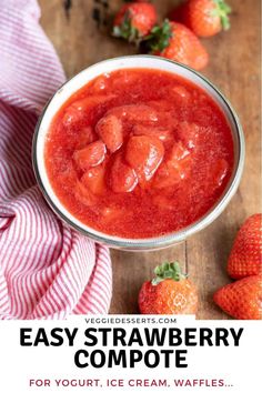 a bowl filled with strawberry compote next to strawberries on a wooden table