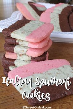 several cookies stacked on top of each other with pink and white frosting in the middle