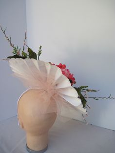 "* This pleated polka dot hat base has a 14\" diameter and has a jumbo 6\" diameter upscale silk peachy pink Peony flower accented with spikes of pastel pink flower vines and spring greens. * Peach millinery netting adds more height and drama to the headpiece. * On a metal headband with a satin ribbon covering it is secure, well balanced and comfortable to wear for extended periods of time. * Upon ordering you will receive this exact headpiece. * Perfect for the Kentucky Derby, Day at the Races, Spring Flower Hats For Races, Spring Races Flower Hat, Handmade Flower Mini Hats For Spring Races, Spring Mini Hats With Handmade Flowers For Races, Elegant Blush Fascinator For Spring, Spring Mini Hat With Handmade Flowers For Races, Whimsical Fitted Fascinator For Spring, Fitted Whimsical Spring Fascinator, Cream Headpiece For Spring Garden Party