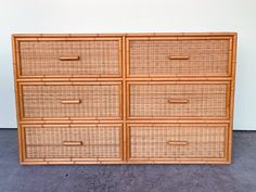 a wicker dresser with four drawers on top