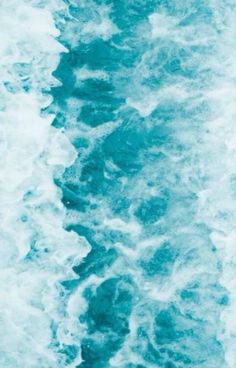 the water is blue and white with waves