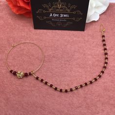 the necklace is on display next to a card that says, a one - jewel