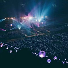 an aerial view of a concert with lights