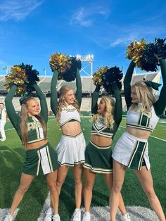 the cheerleaders are all dressed up and ready for their turn to perform on the field