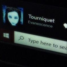 a cell phone screen with the text tourniquet evanesence on it and an image of a woman's face