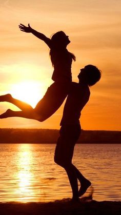 two people jumping into the air in front of a sunset with text reading king perv