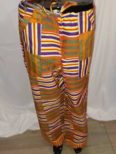 These African Print Pants were handmade in Ghana.  They have secret pockets on each side.   They have a zipper in front and drawstring in the waist.  The pants measure 46-inch hips,  28-inch inseam, pants length is 40 inches. Outdoor Afro Trail Pants Orange, African Print Pants, Pants Length, Print Pants, Printed Pants, Ghana, African Print, Trousers, Zipper