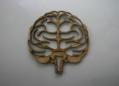 a wooden cutout of a human brain