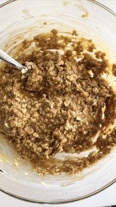 a bowl filled with oatmeal sitting on top of a table