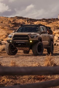 a large truck is parked in the desert