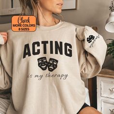 This Custom Acting Sweatshirt is an excellent choice for actors and theatre lovers alike 🎭. The personalized theatre crewneck not only makes a thoughtful gift but also adds a personal touch to the actress's life. Whether you're into drama, musicals, or acting, embrace your love for the stage with this Acting Shirt. Personalize it by adding a name on the sleeve, making it a unique and thoughtful gift for you or your loved ones. 👕 YOUR NEW SWEATSHIRT Our Gildan 18000 sweatshirts are available in Musical Theater Gifts, Theatre Shirts, Theatre Gifts, Musical Theater, Musical Theatre, Sizing Chart, Personal Touch, Printed Items, Acting