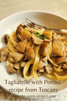 pasta with mushrooms and sauce on a white plate