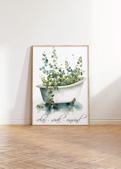 a white bath tub sitting on top of a hard wood floor next to a wall