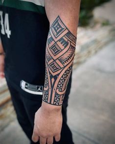 a man with a tattoo on his arm