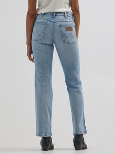 This bold take on our iconic bootcut offers everything the modern cowgirl could want, including a mid-rise waist, a fitted silhouette through the seat, a straight leg through the knee, as well as a perfectly flared leg opening your boots will love. It comes fully loaded with all the Wrangler® icons you know and want: the five-pocket styling, the “W” embroidery, a logo patch, and branded hardware to round out the look. Trust us, these jeans were made for walking. Western Style Straight Leg Flare Jeans In Medium Wash, Straight Leg Bottoms For Rodeo, Modern Cowgirl, Wrangler Jeans, Patch Logo, Online Store, Straight Leg, Women Jeans, Clothes For Women