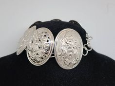 925 Silver Embossed Floral Oval link Panel Bracelet Item w# 1263 Clean and in good condition 7.5 to 7.75 inch fit Traditional Oval Bracelets For Formal Occasions, Traditional Oval Bracelets For Gift, Traditional Oval Bracelets As Gift, Traditional Oval Bracelet For Gift, Sterling Silver Formal Bracelet With Intricate Design, Formal Sterling Silver Bracelet With Intricate Design, Engraved Oval Sterling Silver Bracelets, Engraved Sterling Silver Oval Bracelet, Engraved Oval Sterling Silver Bracelet