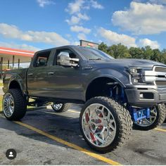 a large gray truck parked in a parking lot