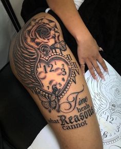 a woman's leg with a tattoo on it and an image of a clock