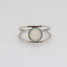 Vintage Sterling Silver White Opal Ring ...Marked 925...Total of weights 2.2grams...Size 8...Measure of stone center 10.2MM...It's in very good condition.  A Nickel-free Opal Silver Ring, Adjustable White Gold Opal Ring In Fine Jewelry Style, Adjustable White Gold Opal Ring, Silver Opal Ring With Round Stone, Silver Solitaire Midi Ring, Opal Gemstone Stackable Rings, Opal Gemstone Stackable Round Rings, Round Opal Solitaire Jewelry, Round Solitaire Opal Jewelry