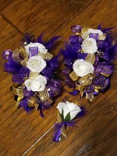 two purple and white flowers are sitting on the floor