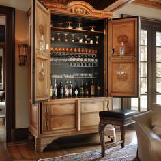 a large wooden cabinet filled with lots of bottles