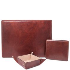 two pieces of brown leather sitting next to each other