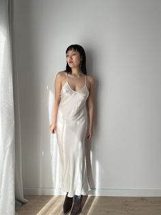 Vintage liquid silk satin backless white slip long maxi camisole dress with lace back cross design, you can wear it as a summer silk slip dress or night party dress.  era: 1990, 2000, Y2K material:100% pure silk Size: around S, Model wears size S, 36 Full length 125cm pit to pit: 36cm waist: 35cm condition: very good condition Please keep in mind that this is vintage second hand piece. It may have small marks and/or snags and sign of wear throughout. Please purchase willing to accept all signs o Slip Dress Club Outfit, Vintage Silk Gown, White Satin Slip Dress For Wedding Night, White Silk Slip Dress For Wedding Night, White Silk Slip Dress For Sleep, White Bias Cut Slip Dress For Sleep, Backless Satin Slip Dress For Night, White Bias Cut Slip Dress For Wedding Night, White Sleeveless Bias Cut Slip Dress