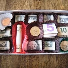 a box filled with lots of different types of money