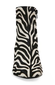 Zebra stripes bring bold visual impact to a statement-making bootie crafted from faux calf hair and set on a curved heel. 2" heel 5 1/2" shaft Side zip closure Synthetic upper, lining and sole Imported Zebra Boots, Zebra Stripes, Calf Hair, Bootie, Me Too Shoes, Side Zip, Steve Madden, Nordstrom, Stripes