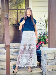 Expertly designed with a long flared skirt in crochet and an elastic waistband, this skirt features a waved bottom opening edge point and a soft knit inner skirt. Versatile and stylish, this solid colored skirt effortlessly transitions from day to night. Size::: ONE SIZE FITS ALL Fabric::: 100% cotton Chic Lace Top Skirt For Spring, Flowy Tiered Lace Maxi Skirt, Chic Spring Maxi Skirt With Lace Trim, Chic Lace Maxi Skirt With Lace Trim, Spring Lace Trim Flared Maxi Skirt, Spring Flared Maxi Skirt With Lace Trim, Chic Flared Skirt With Lace Trim, Chic Pointelle Knit Spring Skirt, Chic Pointelle Knit Skirt For Spring