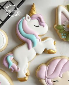 decorated cookies with unicorns and stars on them